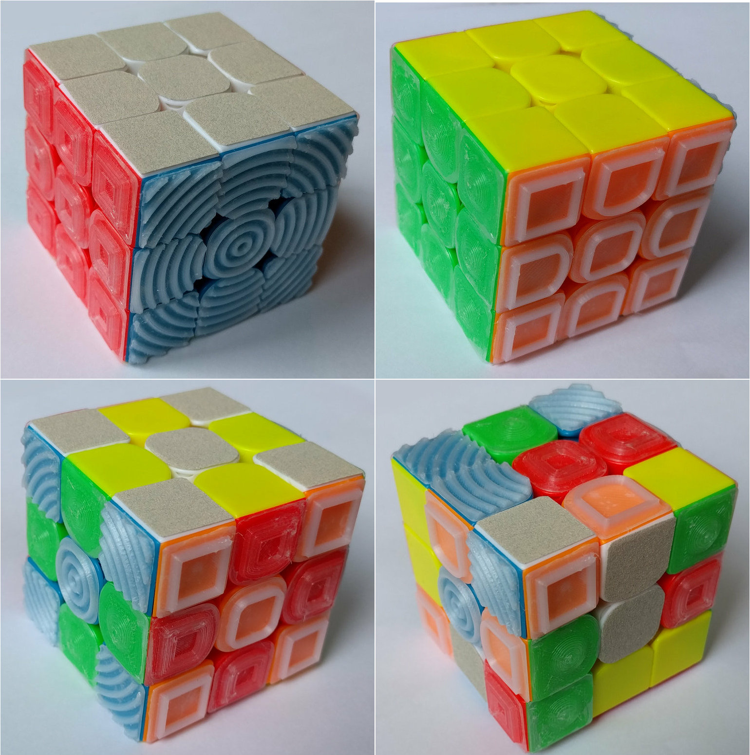 Four views of a 3x3x3 twisting puzzle cube. The tiles of the puzzle are distinguishable both by color and by texture. The six surface textures are: unadorned plastic (yellow), sandpaper (white), high narrow walls (orange), low thick walls (red), ripples (blue), and bumps (green).
